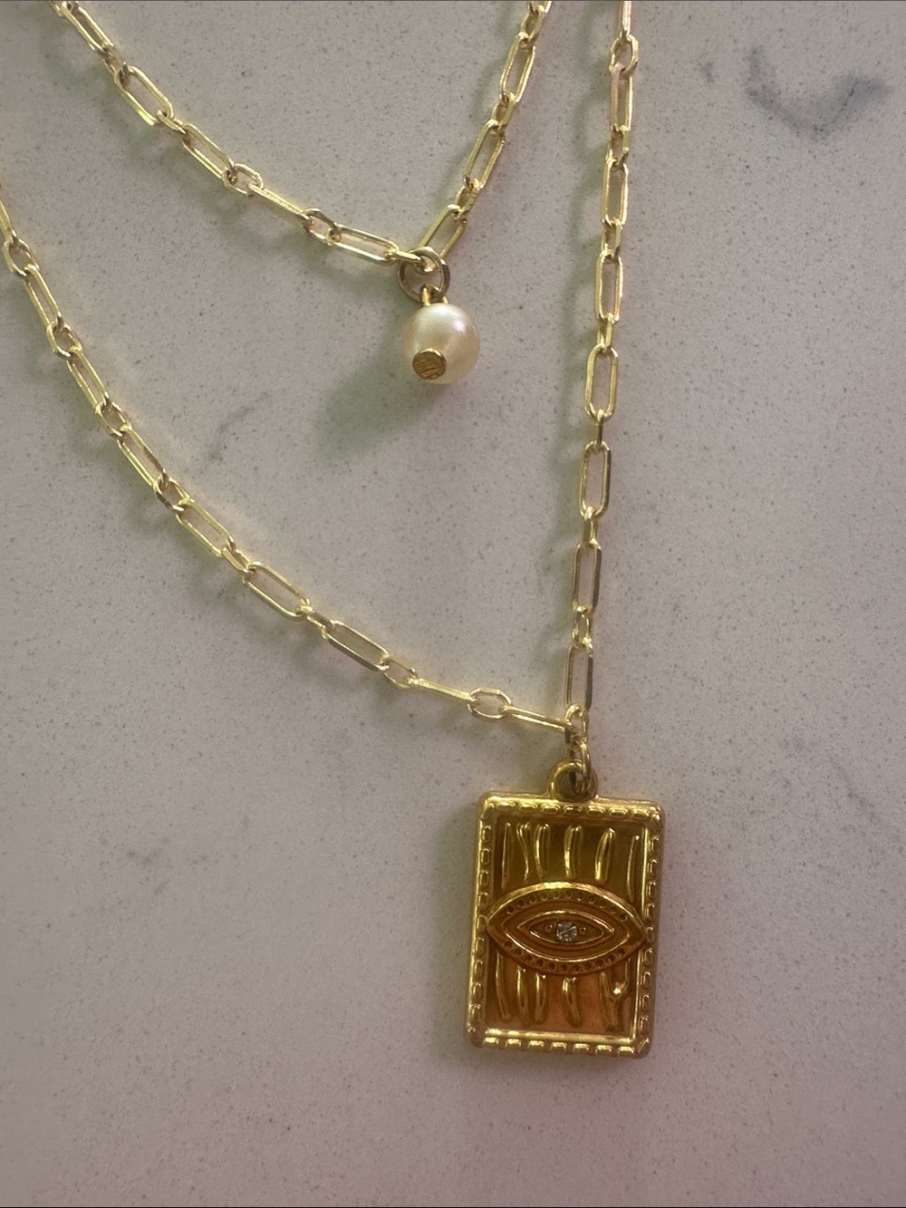 Gold Layered Eye Pendant Necklace with Pearl Accent